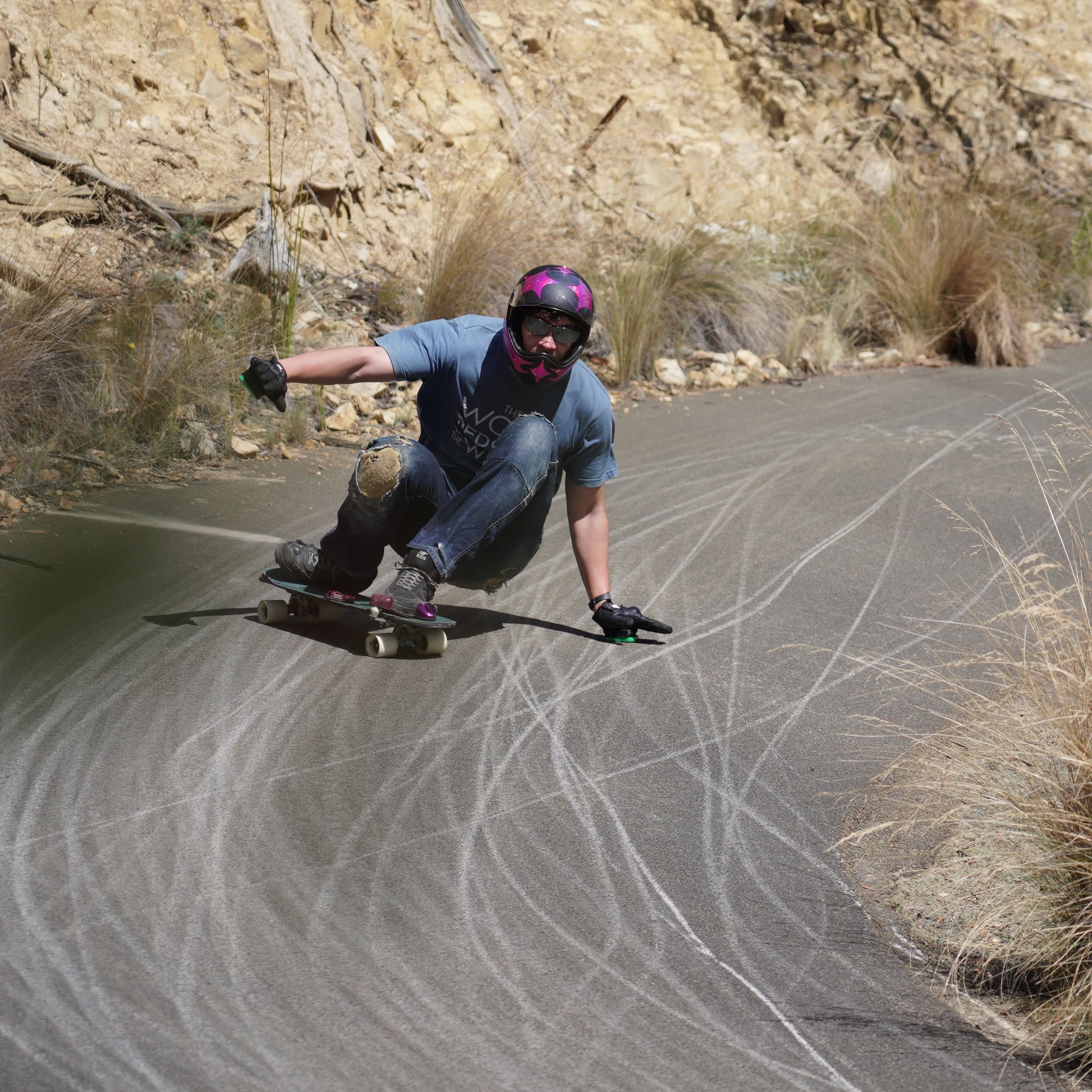 Caspian Baska leaning with a skateboard